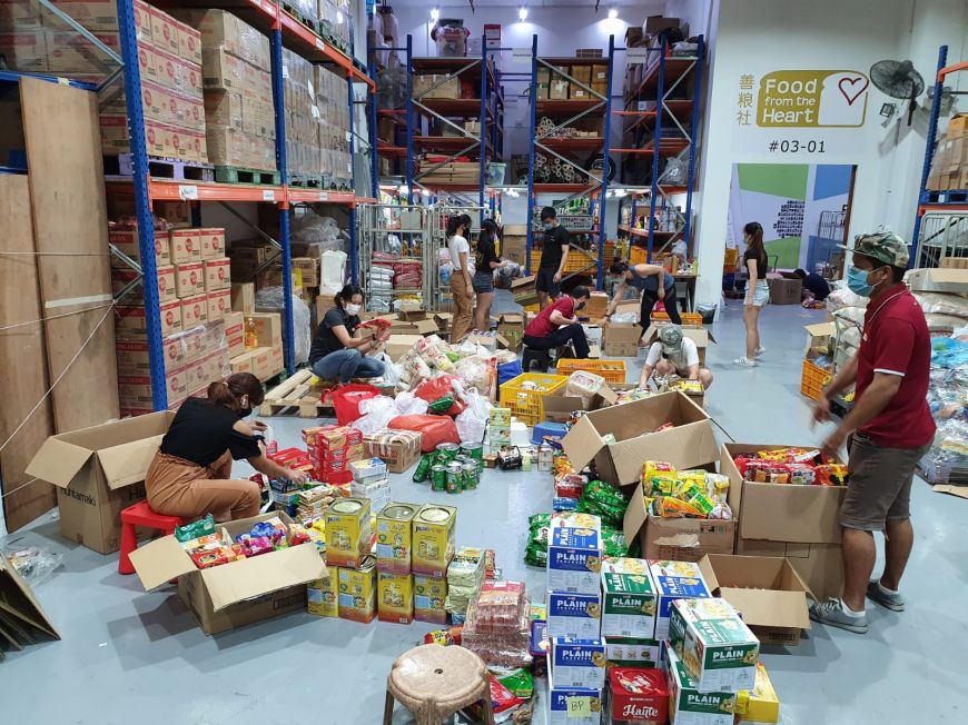 Food from the Heart volunteers sorting food at the warehouse