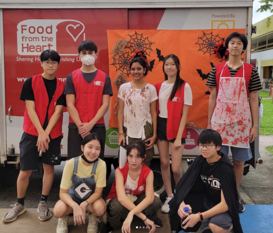 Volunteers from the School American School at FFTH's halloween food drive